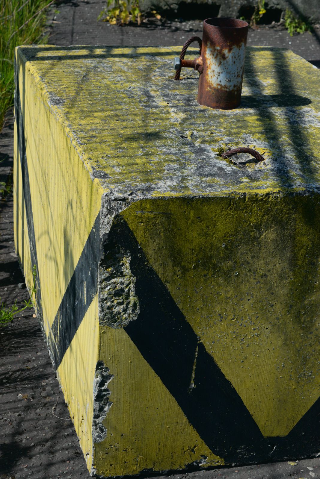 Industrial texture photograph — weathered metal, concrete and structural detail