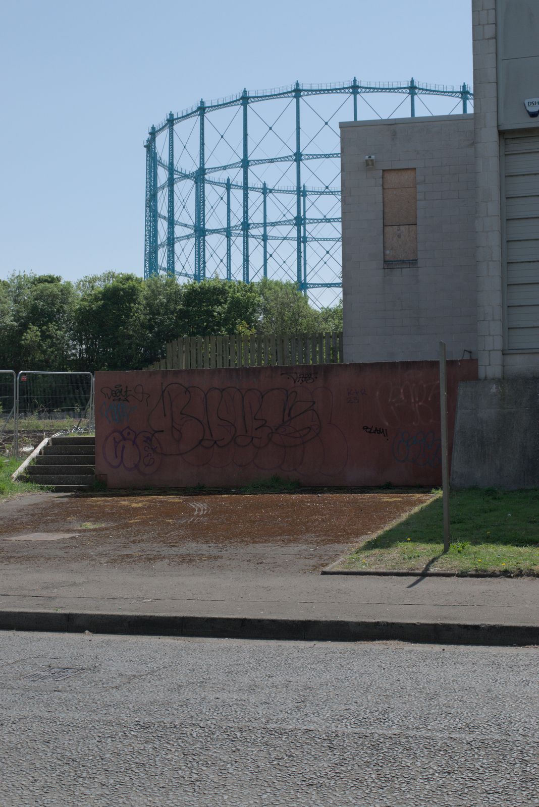Photograph of a sign or marking out of context, left behind in an edgeland